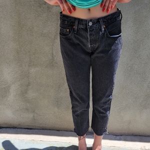 Black Levi's 501 T with frayed edge